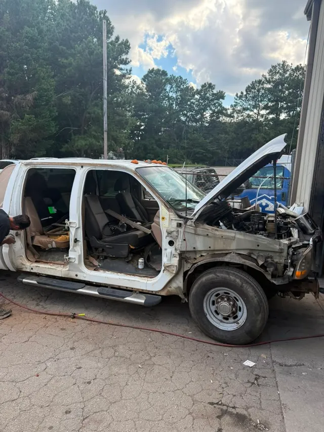 White van — collision before — Stop N Go auto body & paint, Stone Mountain GA