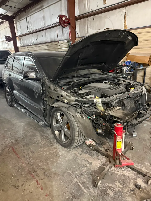 Black suv — collision before — Stop N Go auto body & paint, Stone Mountain GA